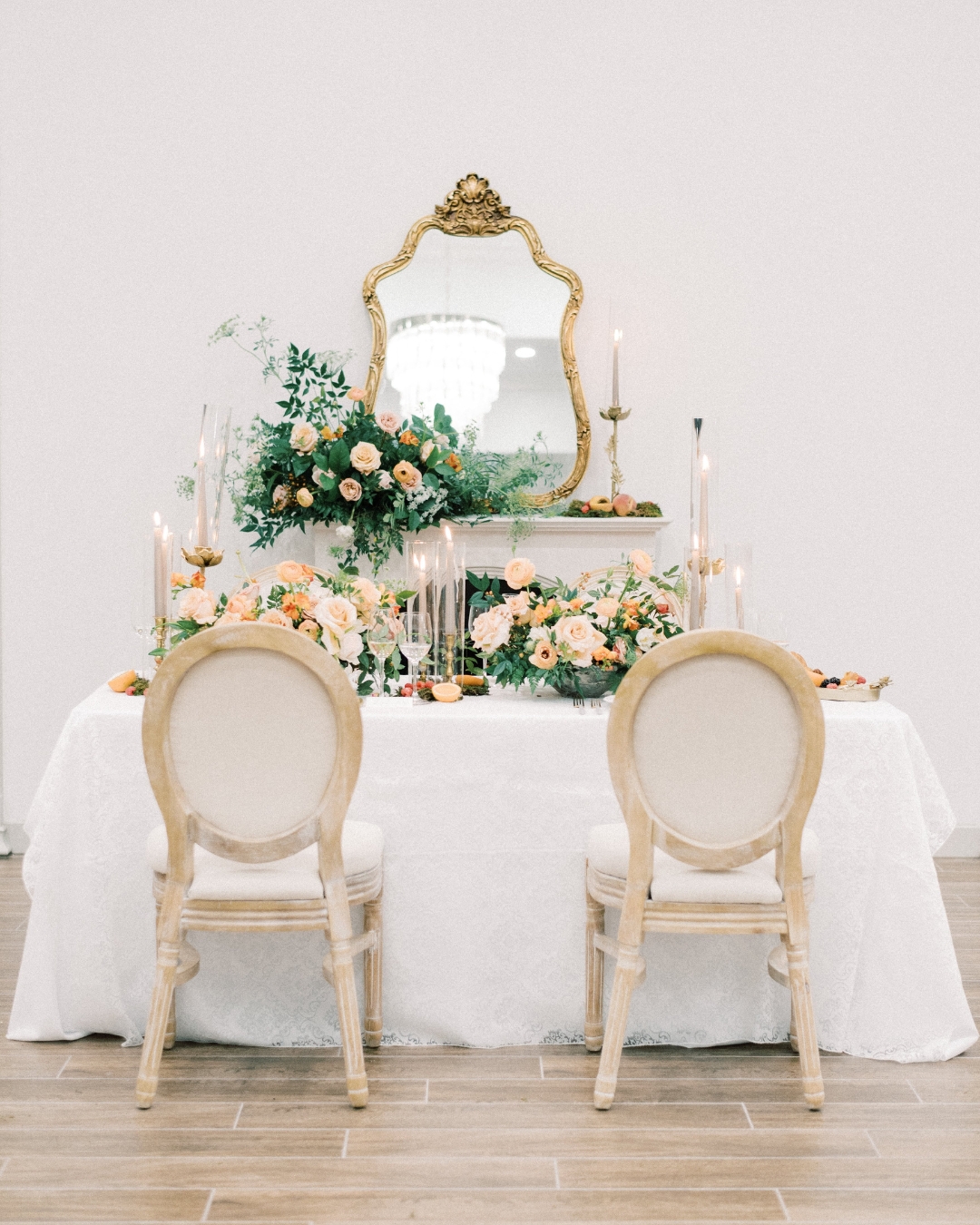 linen chairs and bride and groom's wedding reception table