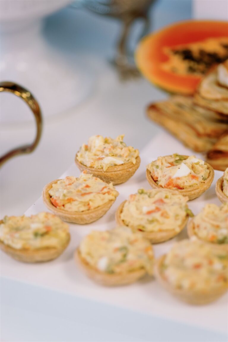 Guests enjoying light refreshments, including quiches and tea sandwiches, at a bridal shower at Andolina Intimate Venue in old downtown Duncanville.