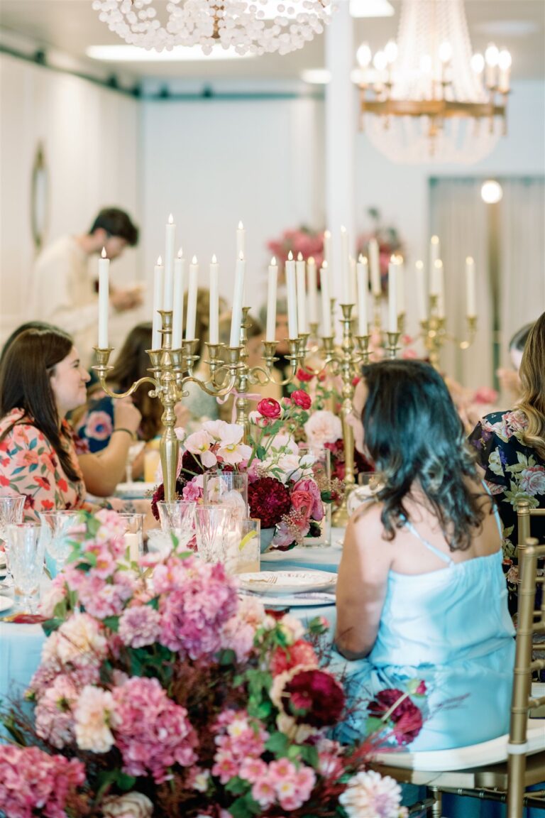 A beautifully set table at Andolina Intimate Venue, adorned with elegant vintage dinnerware and floral centerpieces, ready for a High Tea bridal shower celebration